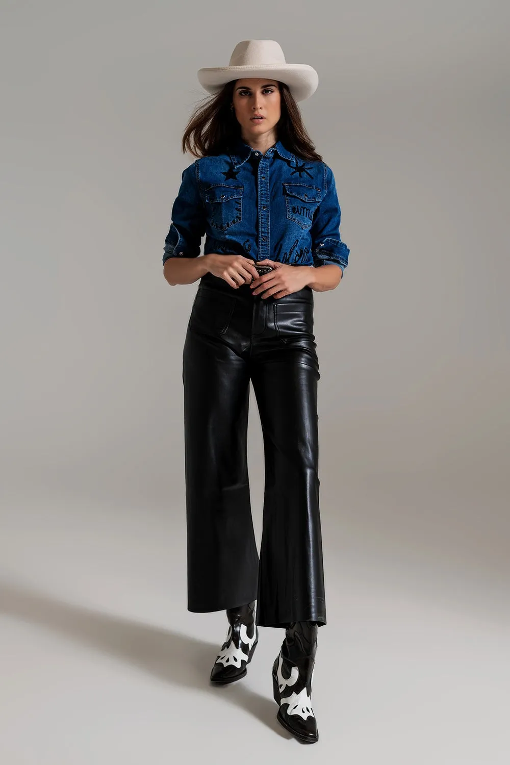 black palazzo-style faux leather pants with pocket detail