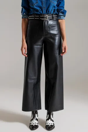 black palazzo-style faux leather pants with pocket detail